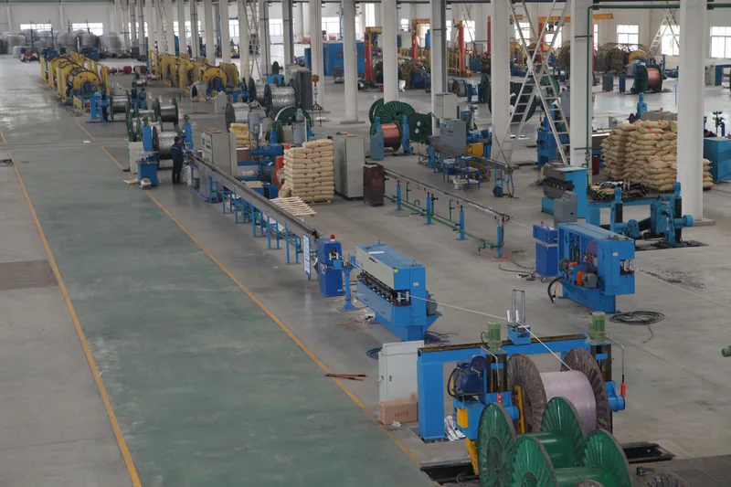 Wide view of the cable workshop with production lines and cable drums
