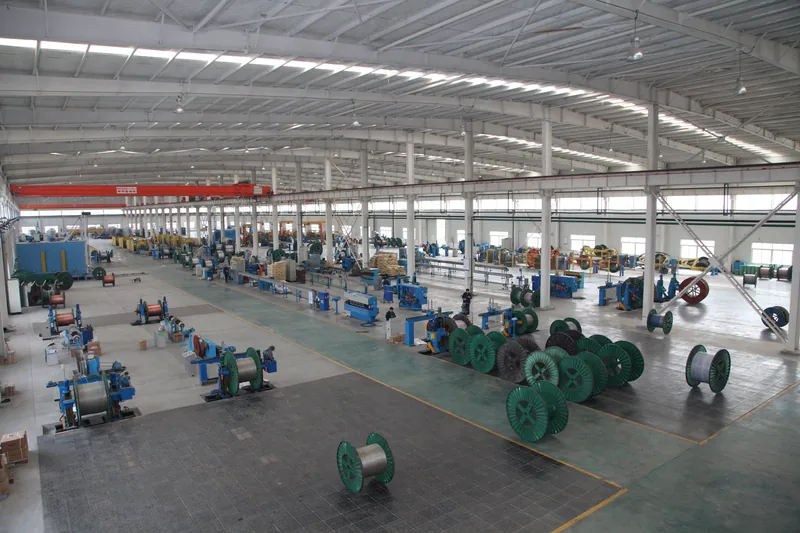 Overhead view of the cable workshop, equipment and drums laid out in rows