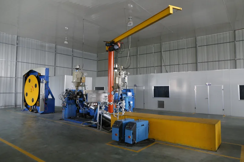 Extrusion machine group with jib crane and safety guardrail