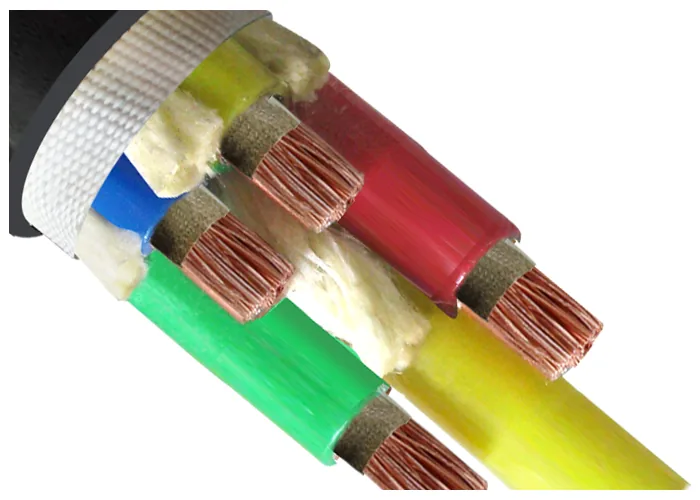Cable cut back at an angle with the black sheath opened out to a woven white bedding tape over four insulated cores in white filler
