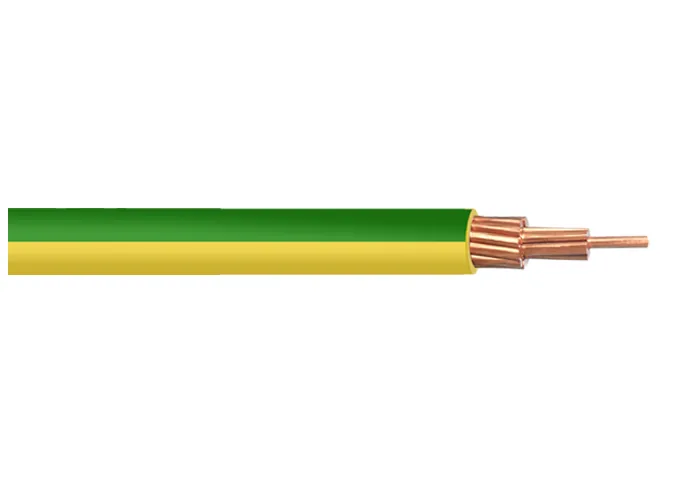 Flat green-and-yellow insulated conductor lying beside a length of bare stranded copper