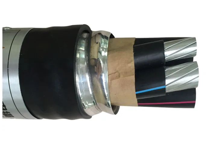 Power cable cut back through two wrapped tape armour layers and a bedding layer to the insulated cores