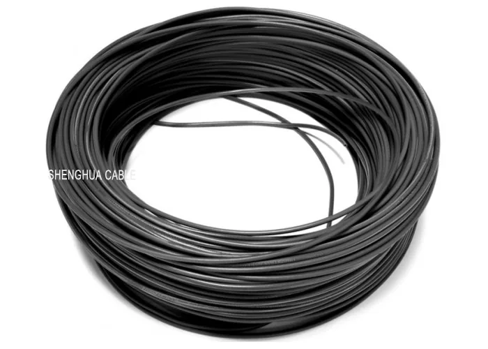 Coil of black sheathed cable wound and tied, with the printed sheath visible on the outside
